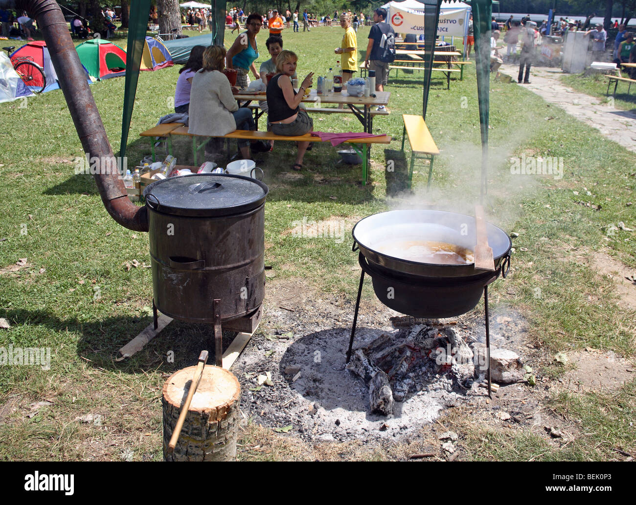Outdoor kitchen food preparing on open fire. Stock Photo