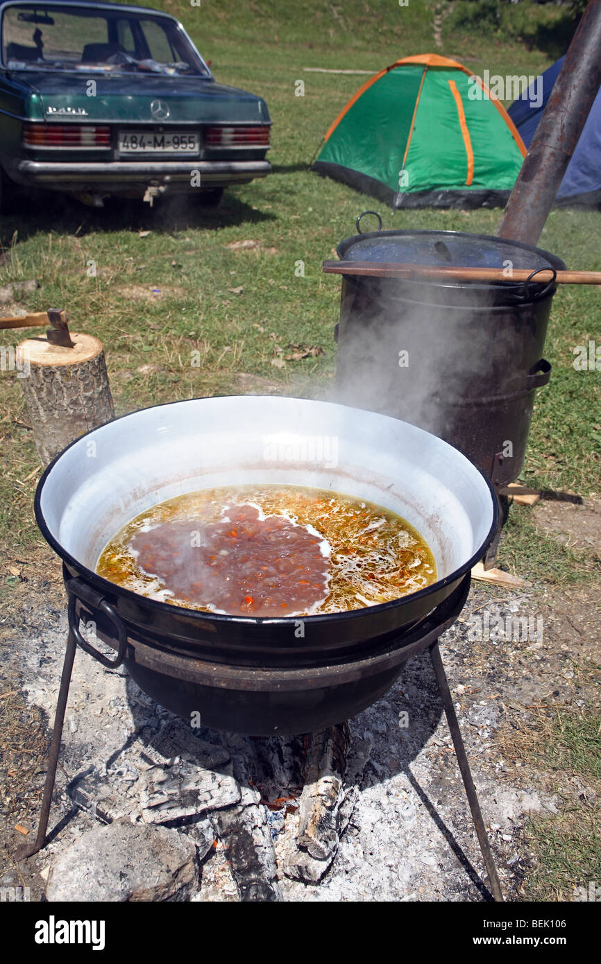 Outdoor kitchen food preparing on open fire. Stock Photo