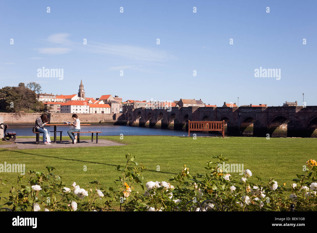 Tweedmouth, Northumberland, England, UK. View across the River Tweed to Berwick upon Tweed town waterfront by the old bridge Stock Photo