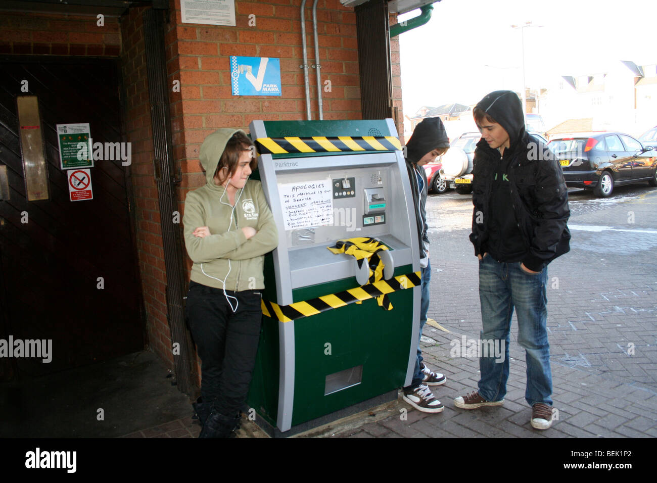 kids looking at out of order parking machine Stock Photo