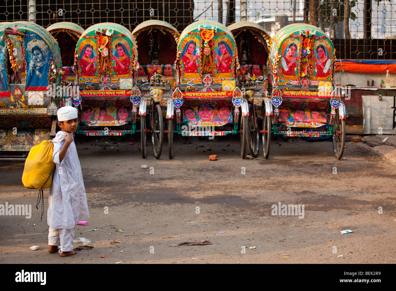 Muslim Boy and Rickshaws in Dhaka Bangladesh Stock Photo