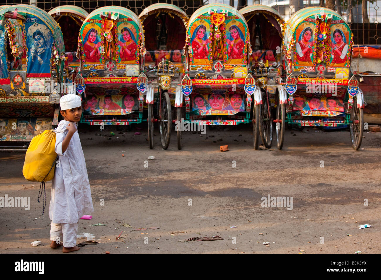 Muslim Boy and Rickshaws in Dhaka Bangladesh Stock Photo