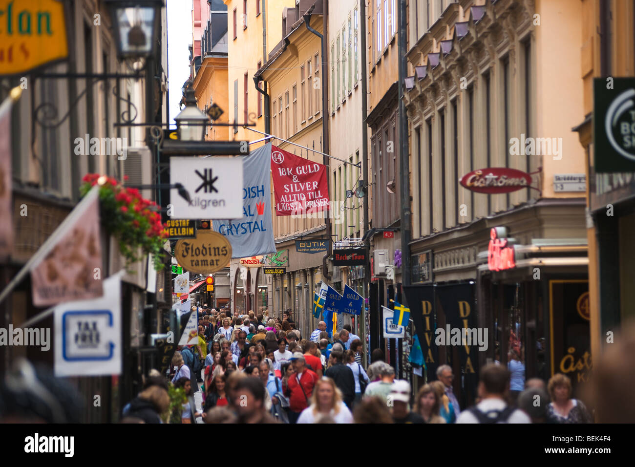 Crowds of shoppers shopping below the signs on busy tourist street  Västerlånggatan in Stockholm's old town, Gamla Stan Stock Photo - Alamy