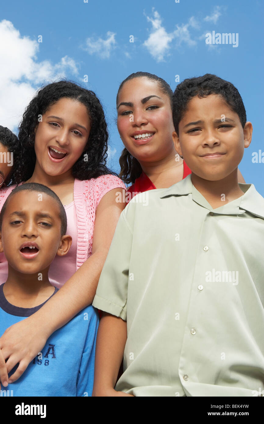 Portrait of two teenage girls and two boys smiling Stock Photo - Alamy