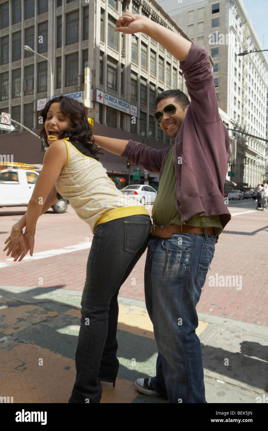 Side profile of a young couple reggaeton dancing on the road Stock Photo -  Alamy