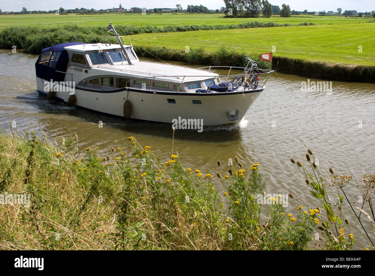 Tourist boat on the river IJzer in Lo-Reninge, Belgium Stock Photo