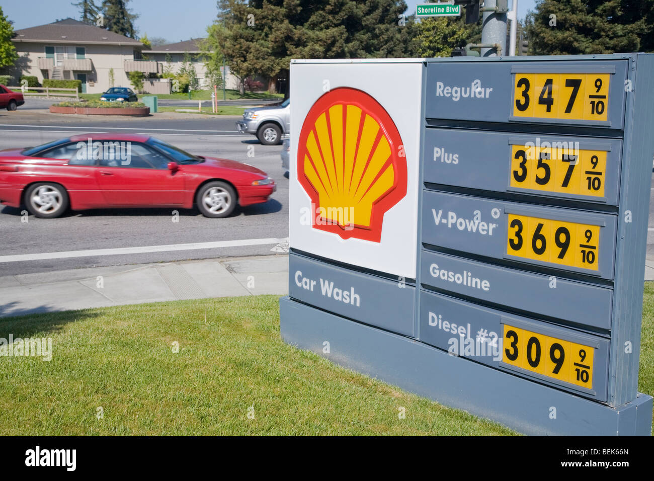 A red car passing a Shell gas price list. on April 24, 2007. Prices way over three dollars a gallon. Mountain View, California Stock Photo