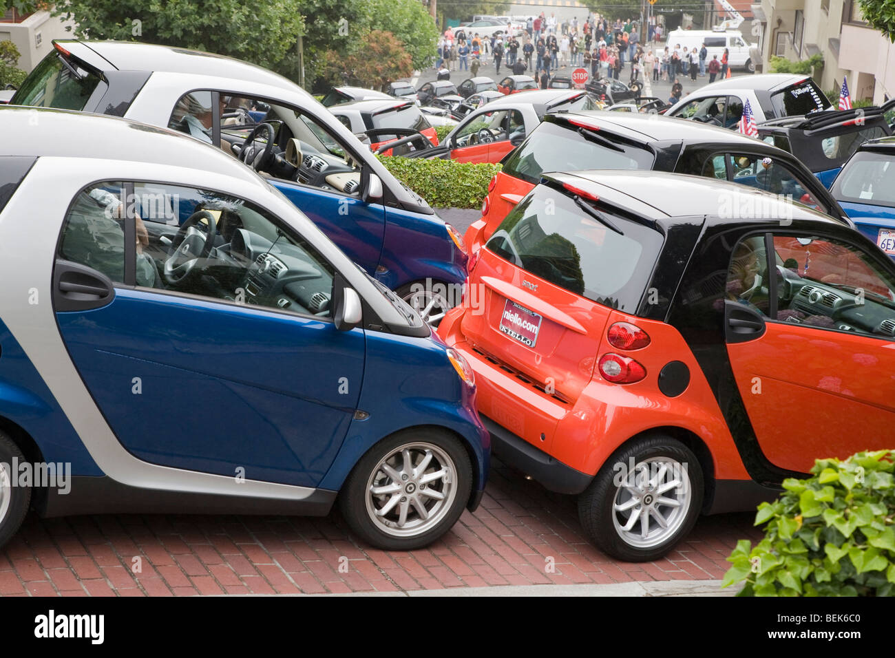 Smart Car enthusiasts packed approximately 130 of their compact cars into Lombard Street for photo shoot during car club rally. Stock Photo