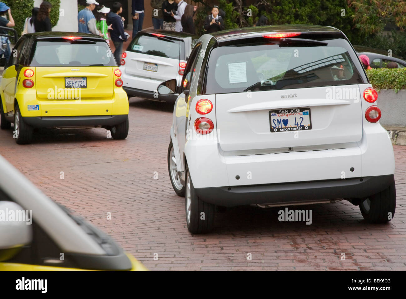 A rear view of Smart Cars on street. Lombard Street, San Francisco, California, USA Stock Photo