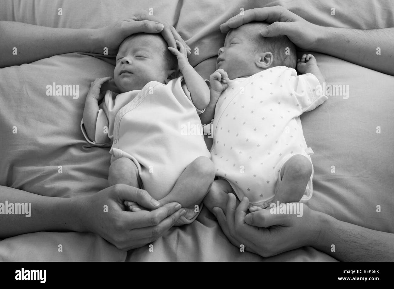 Parents demonstrating containment holding for premature babies Stock