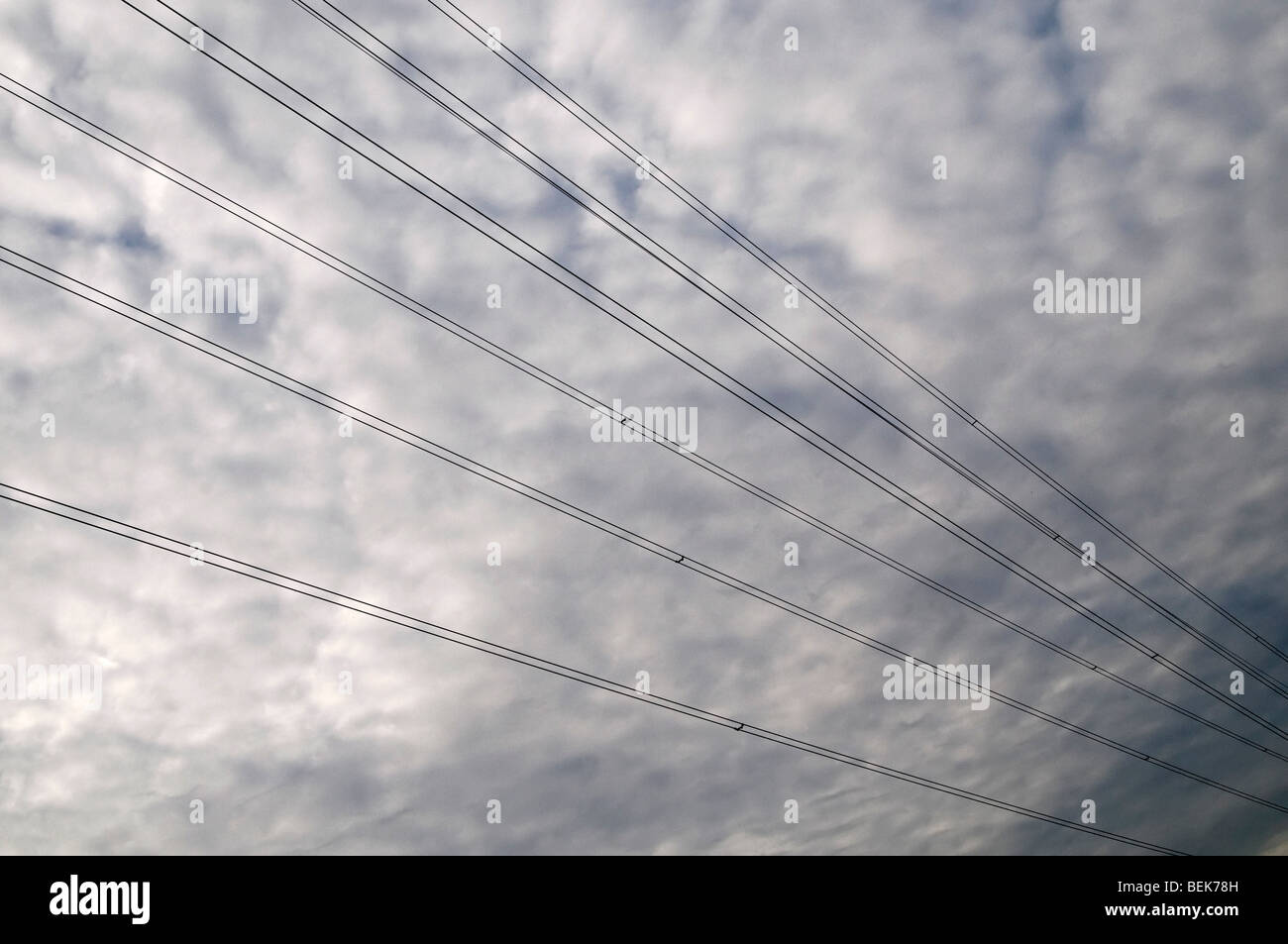 Power line against blue sky and sun power lines hi-res stock ...