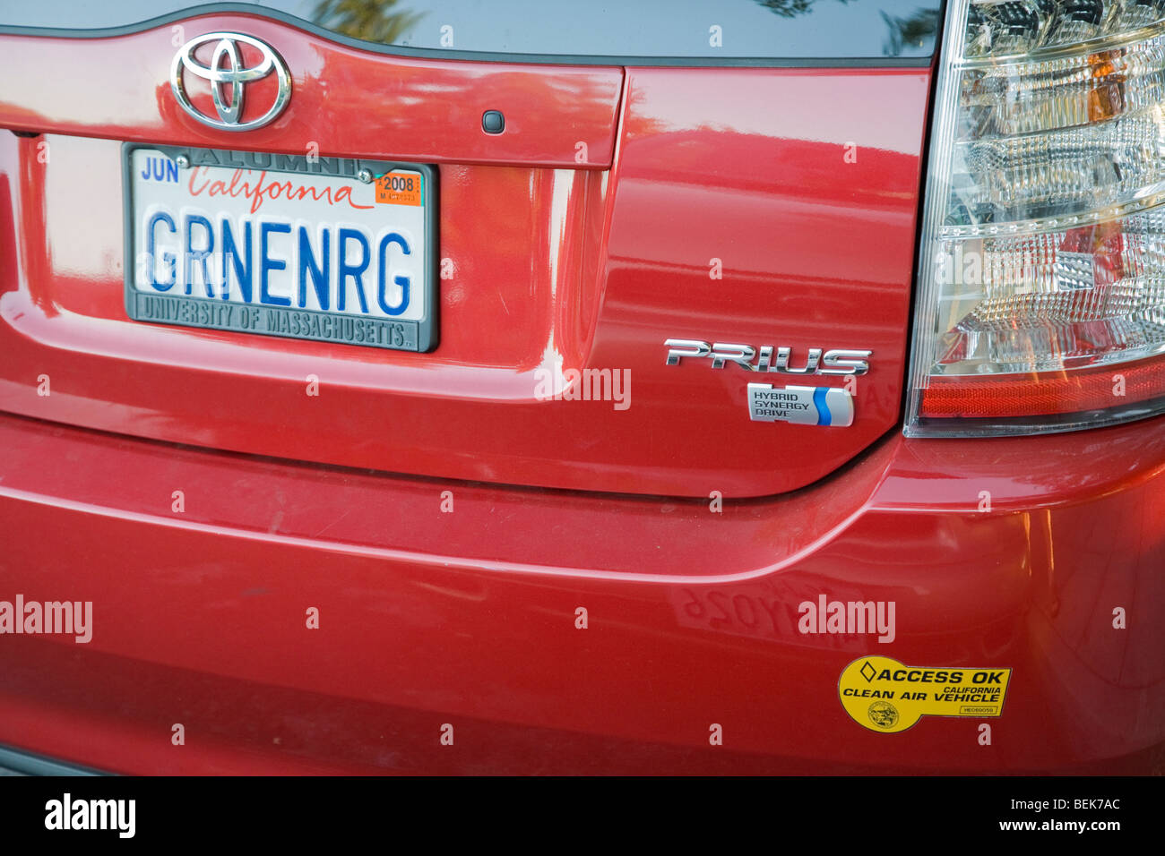 Toyota Prius with a 'GRNENRG' (Green Energy) license plate and a clean air vehicle sticker. Stock Photo