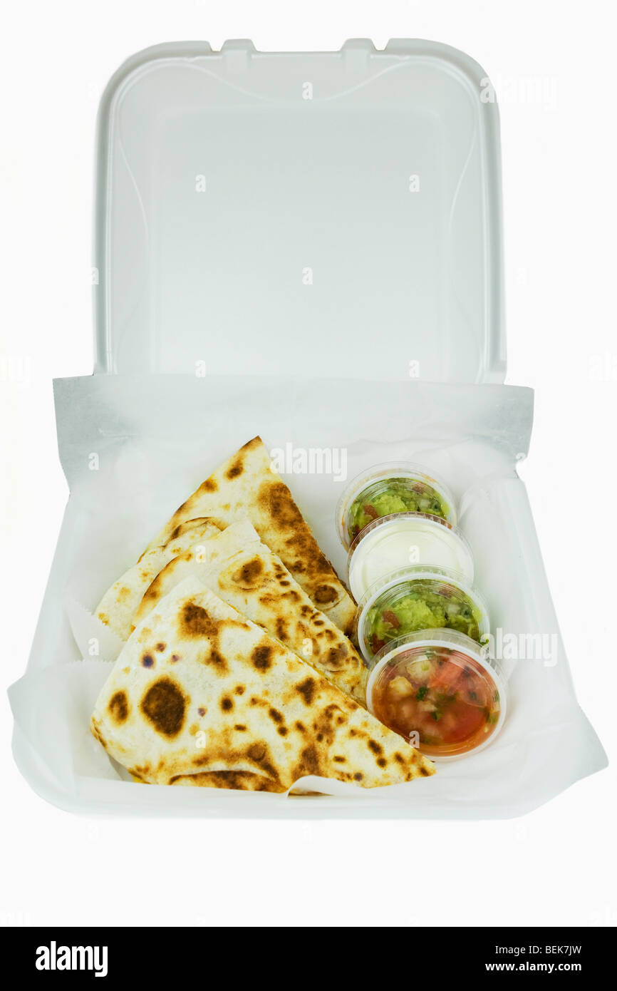 High angle view of quesadillas with assorted condiments in a box Stock Photo