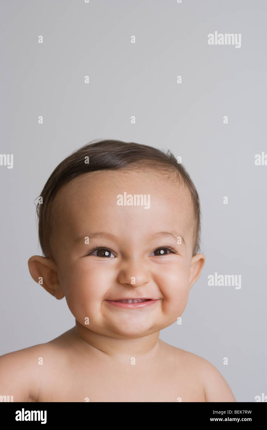 Close-up of a baby boy smiling Stock Photo