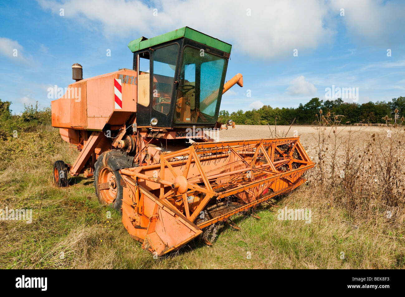 Old, broken Fiat Someca combine harvester Indre, France Stock Photo