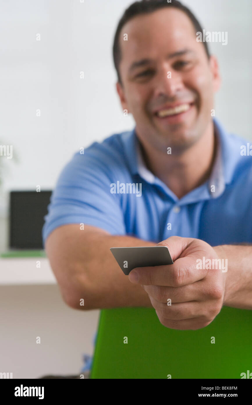 Man showing a credit card Stock Photo