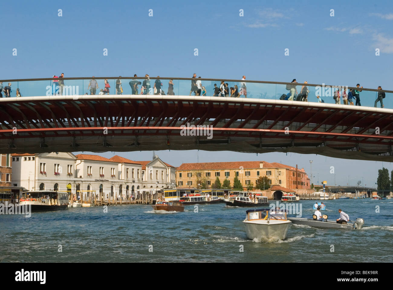 Venice Italy Tourists arrive in Venice walk over Ponte della Costituzione  Grand Canal from Piazza Roma. HOMER SYKES Stock Photo