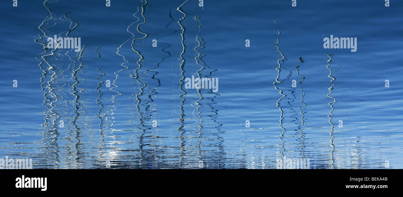 Boats abstract reflexion over blue mediterranean saltwater Stock Photo