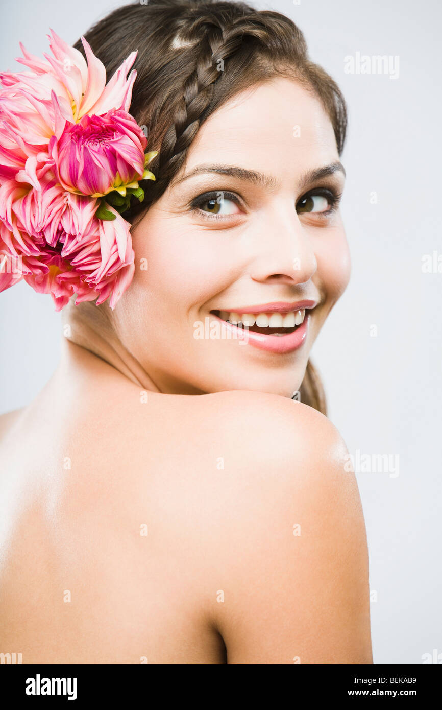Close-up of a woman wearing flowers Stock Photo