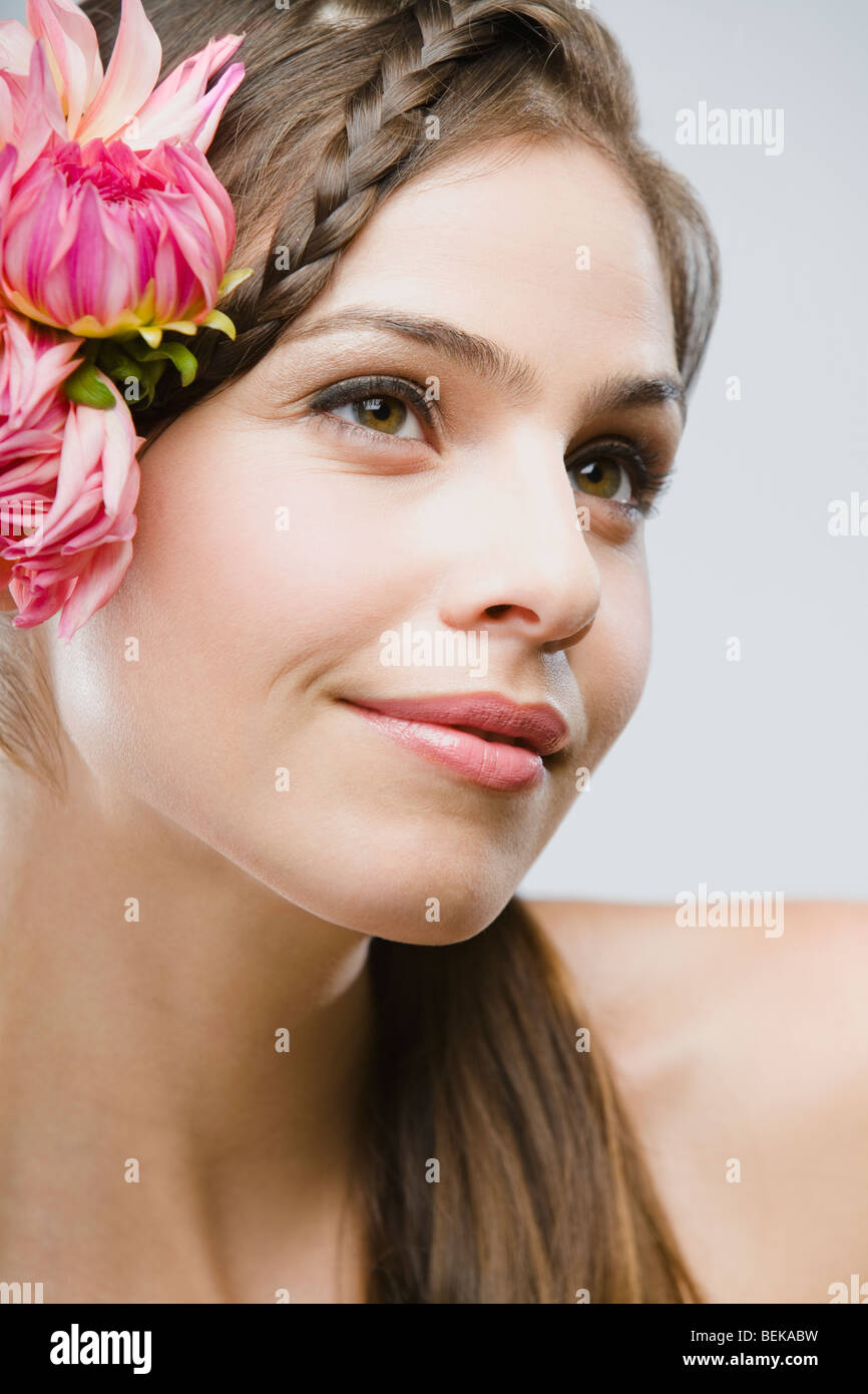 Close-up of a woman wearing flowers Stock Photo