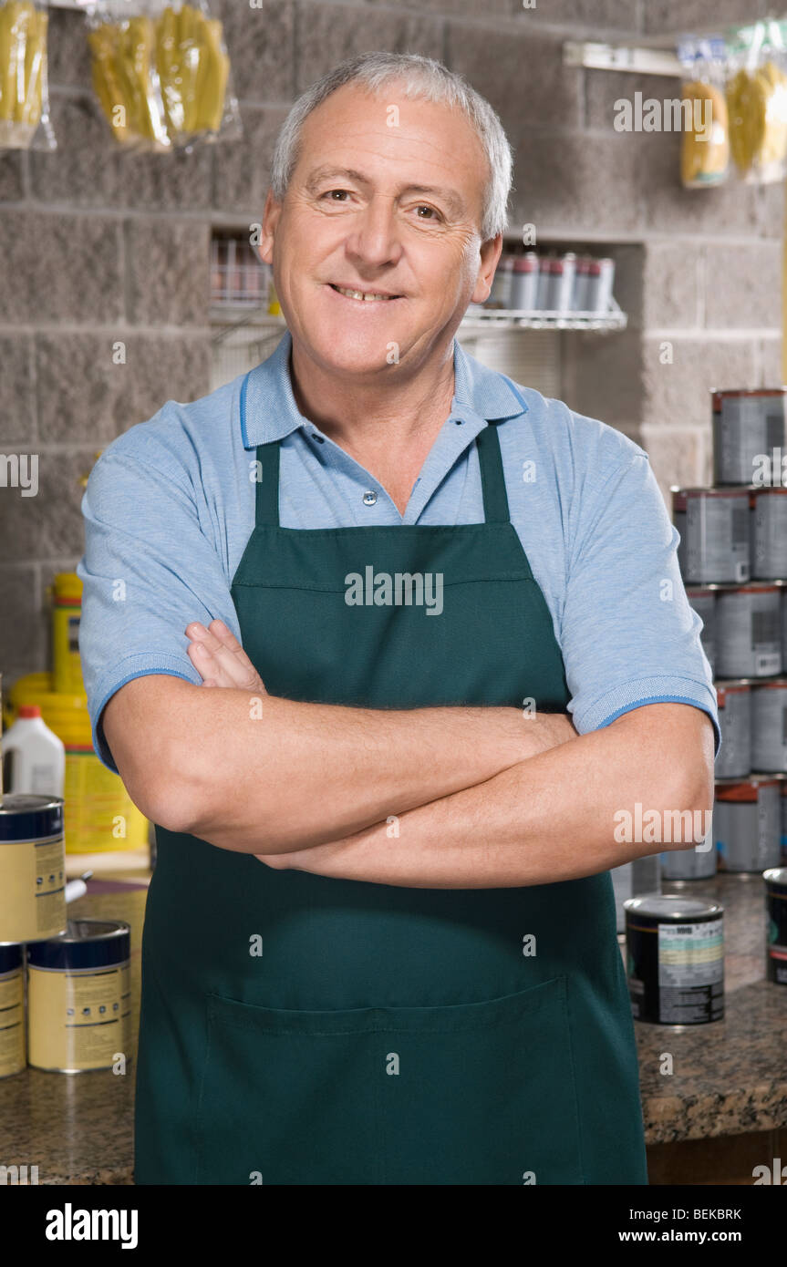 Portrait of a sales clerk smiling in a hardware store Stock Photo Alamy
