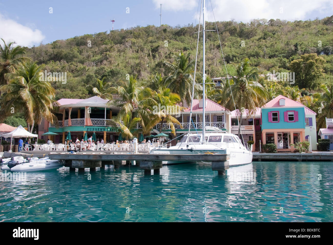 Catamaran moored in front of Pusser's Landing at Soper's Hole, BVI Stock Photo