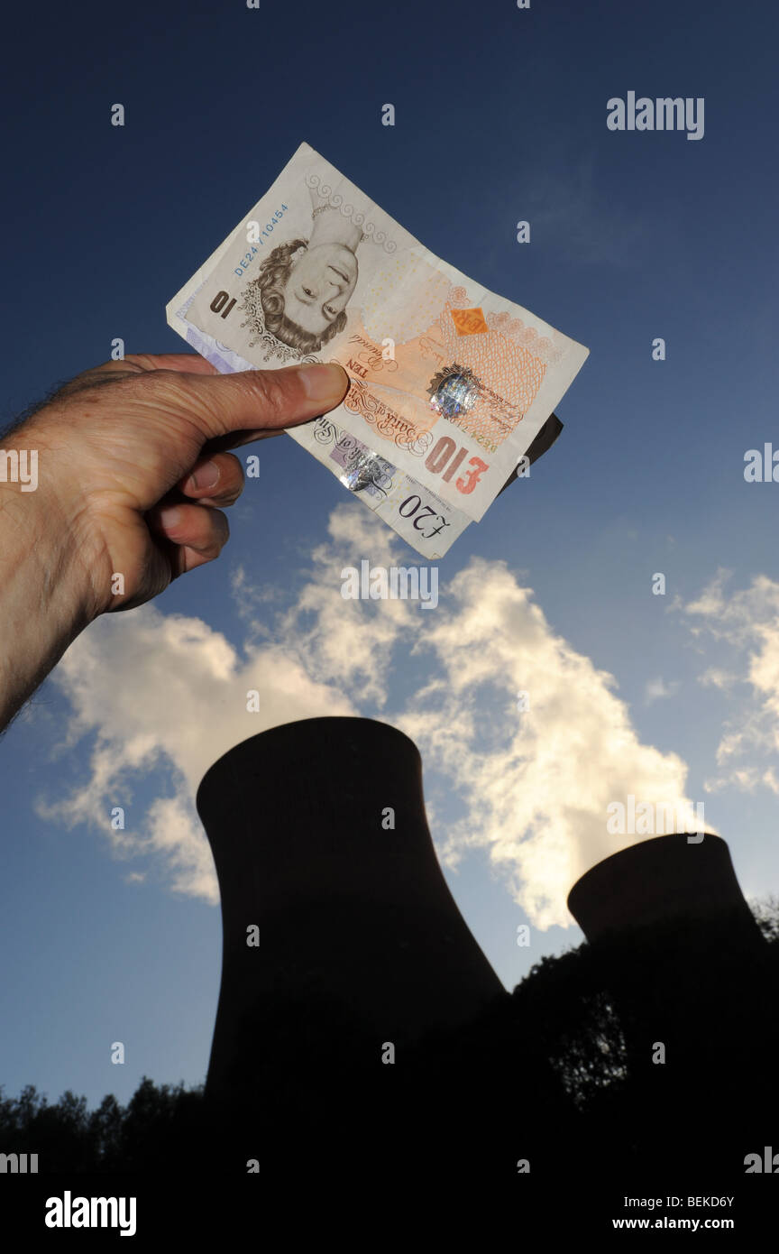 Rising energy costs depicted with money and power station Stock Photo