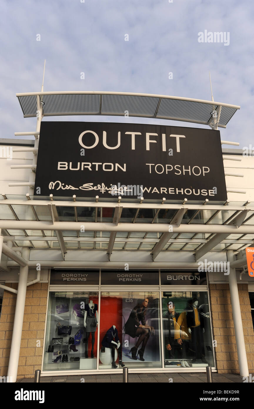 The Oufit store sign and logo England Uk Stock Photo