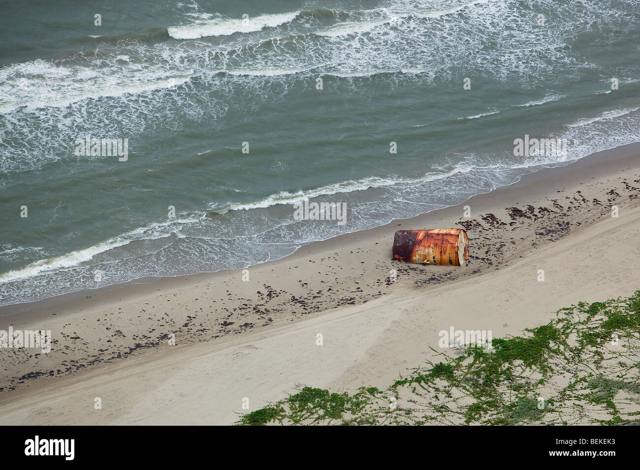 aerial view above rusting steel barrel Padre Island beach Texas Stock Photo