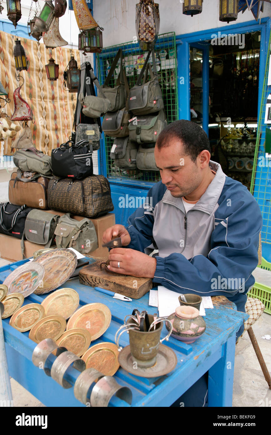 Metal worker at the medina in Hammamet, Tunisia Stock Photo