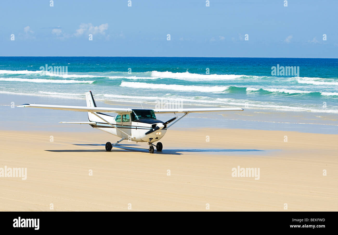 Shot of a Light Aircraft Taking off on Beach on Fraser Island, Australia Stock Photo