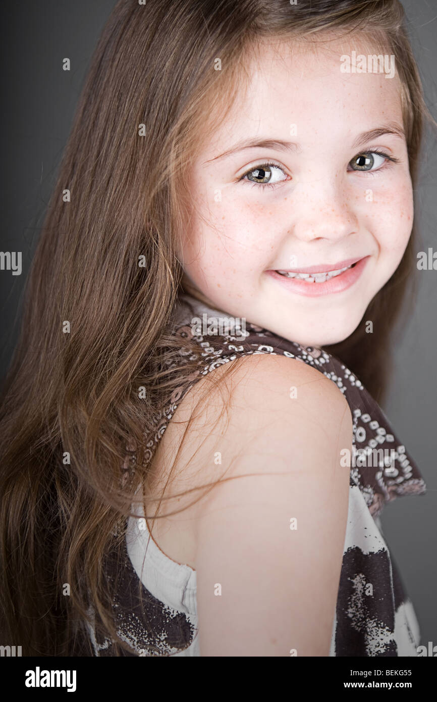 Shot Of A Cute Brown Haired Child Smiling Stock Photo 26245329