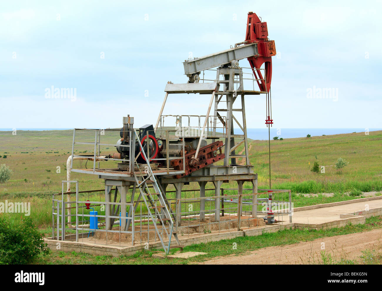 Oil produce plant in prairie (not far from the sea) Stock Photo