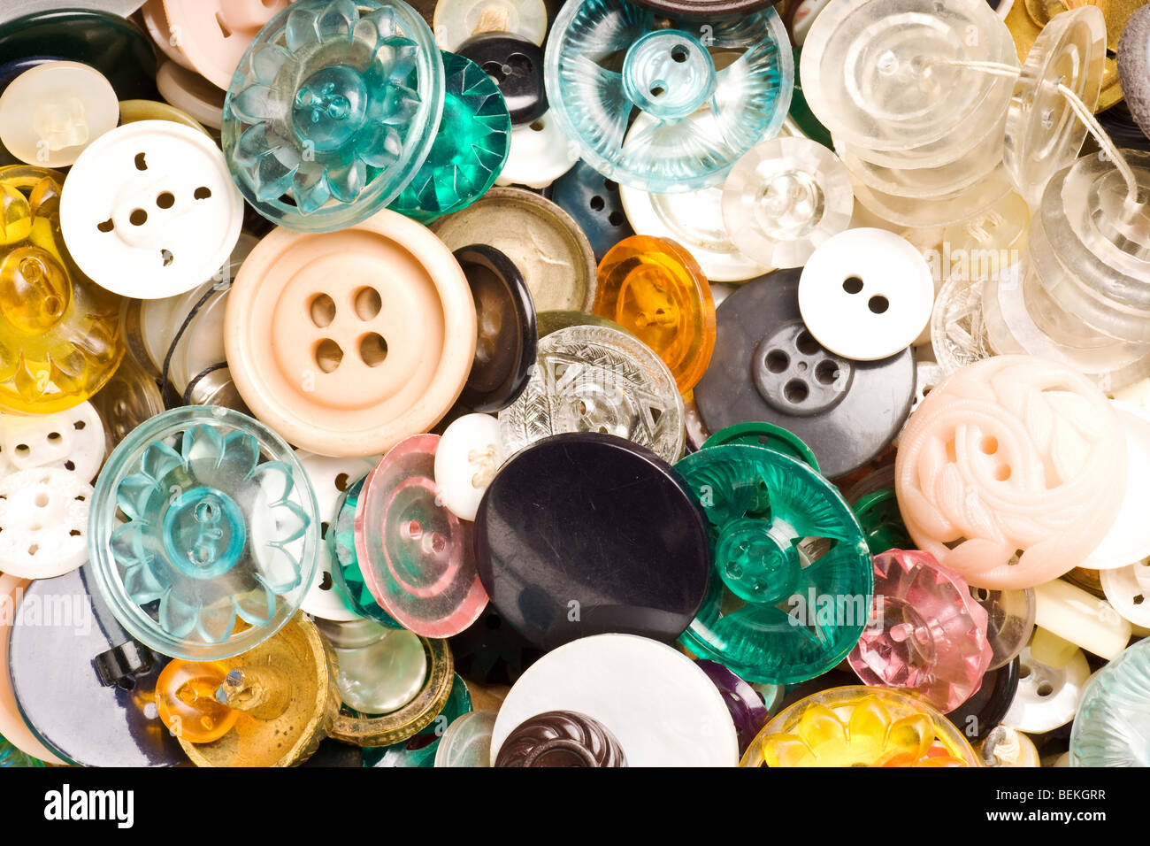 many kinds of different antique buttons background Stock Photo