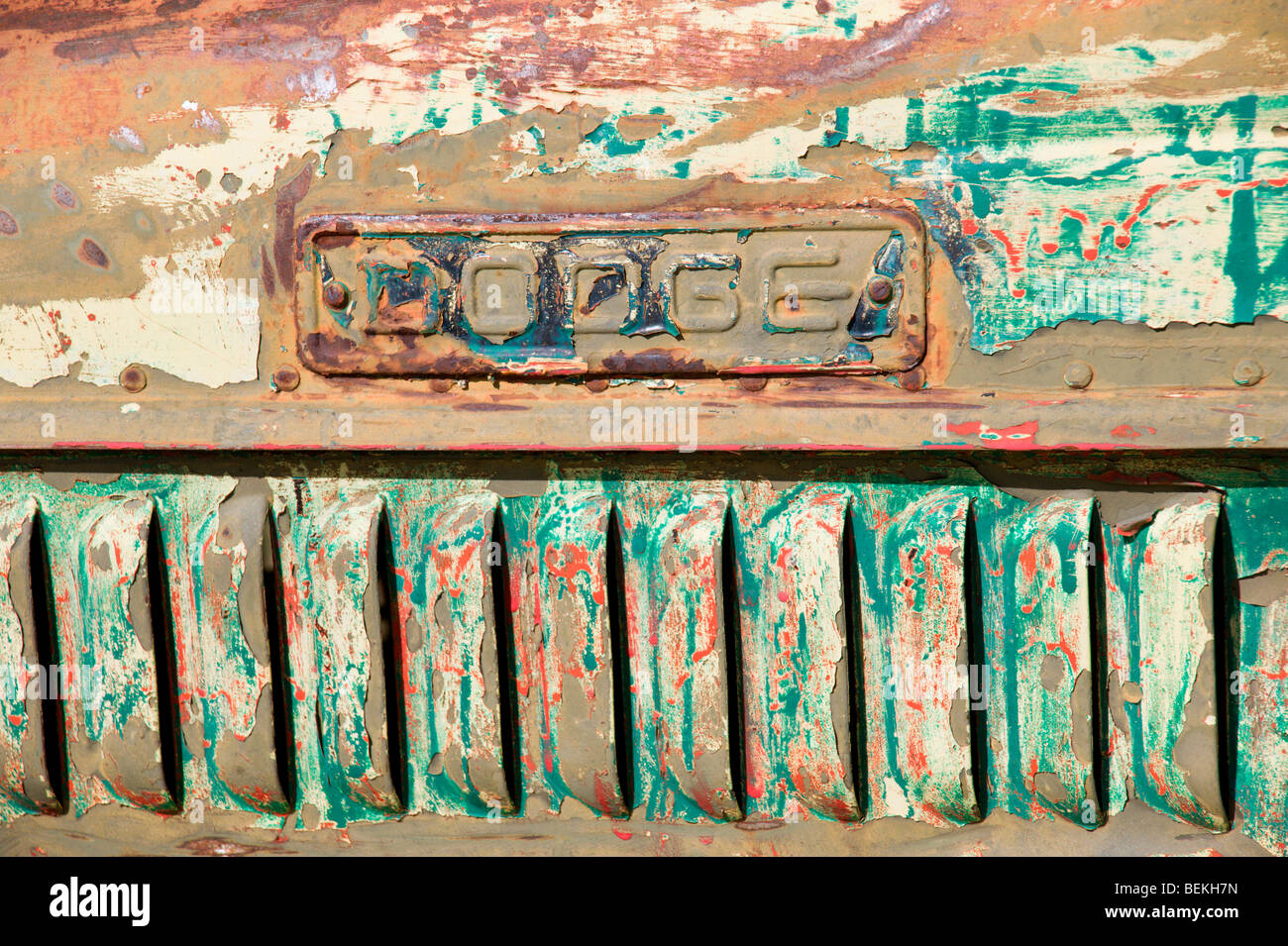 Close-up and detail of an old Dodge truck hood revealing many layers of paint, in the gold mining ghost town - Elizabethtown, NM Stock Photo