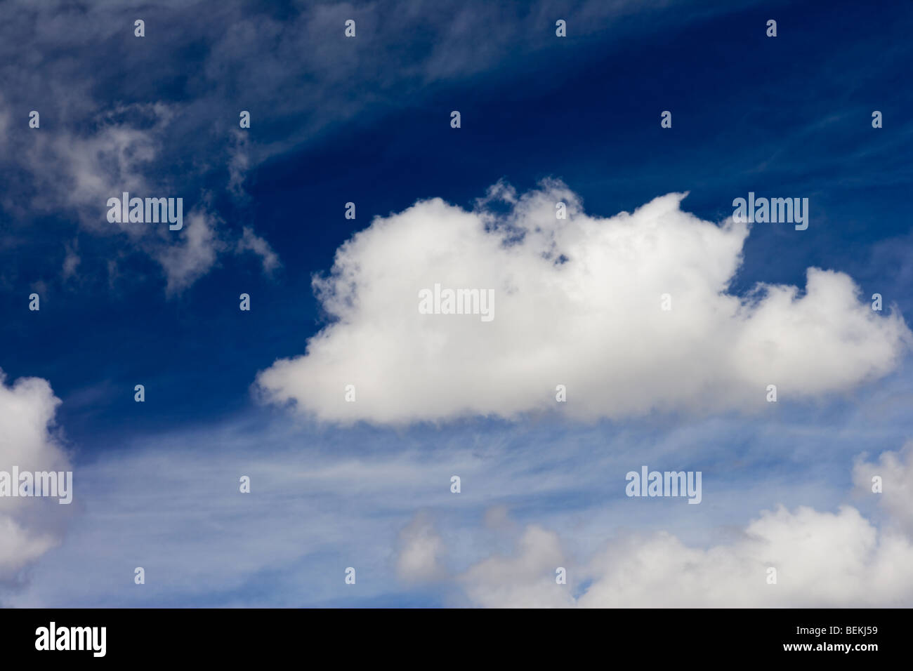 blue sky with white fluffy clouds background Stock Photo - Alamy