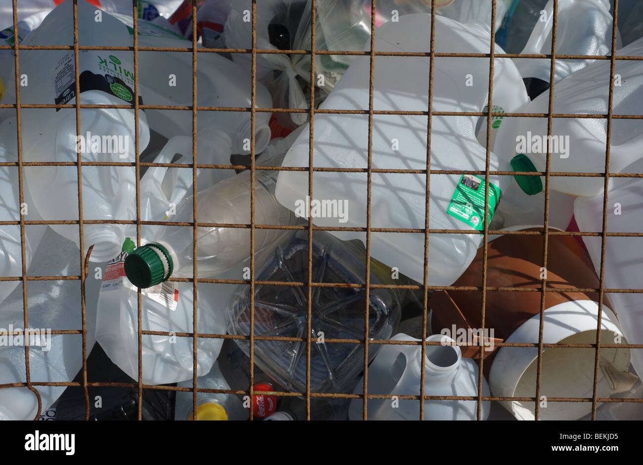 A variety of plastic bottles in a collection cage or container ready for recycling Stock Photo