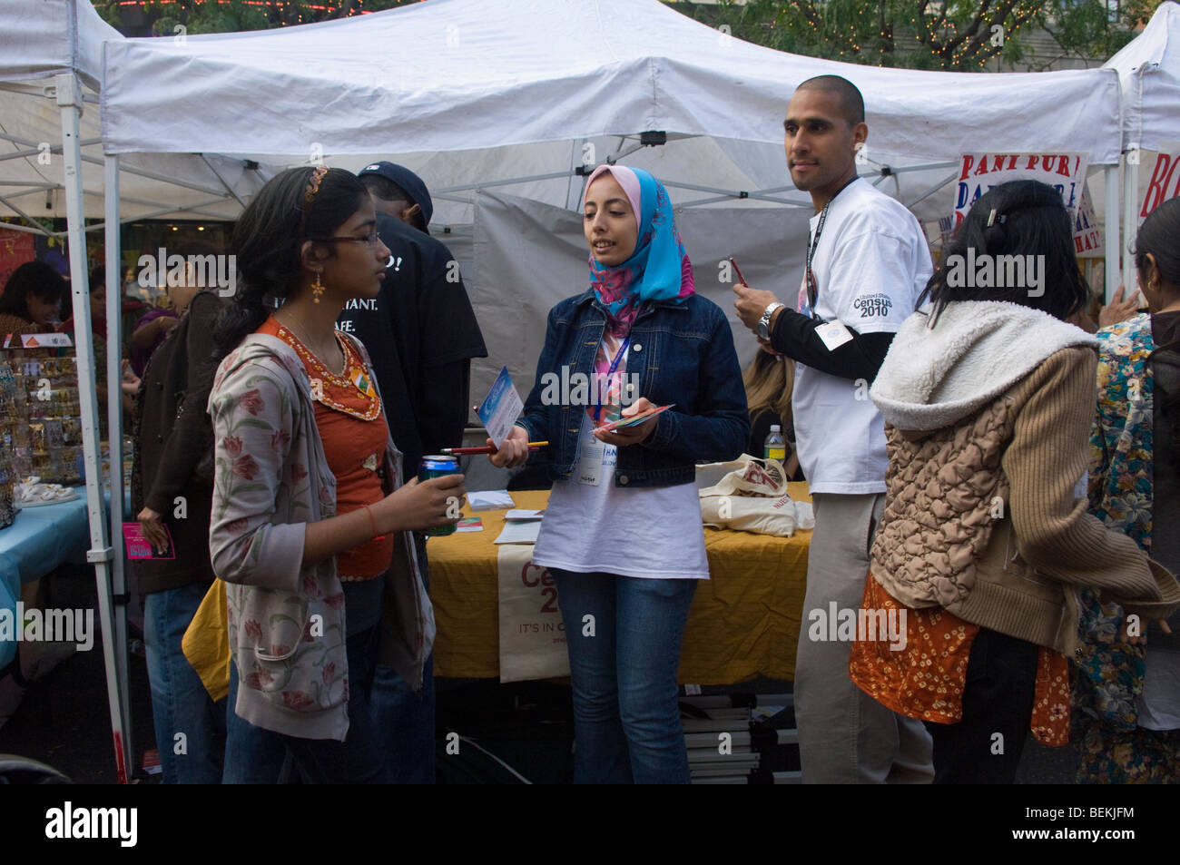 US census outreach workers pass out information about the 2010 census in the Queens neighborhood of Jackson Heights in New York Stock Photo