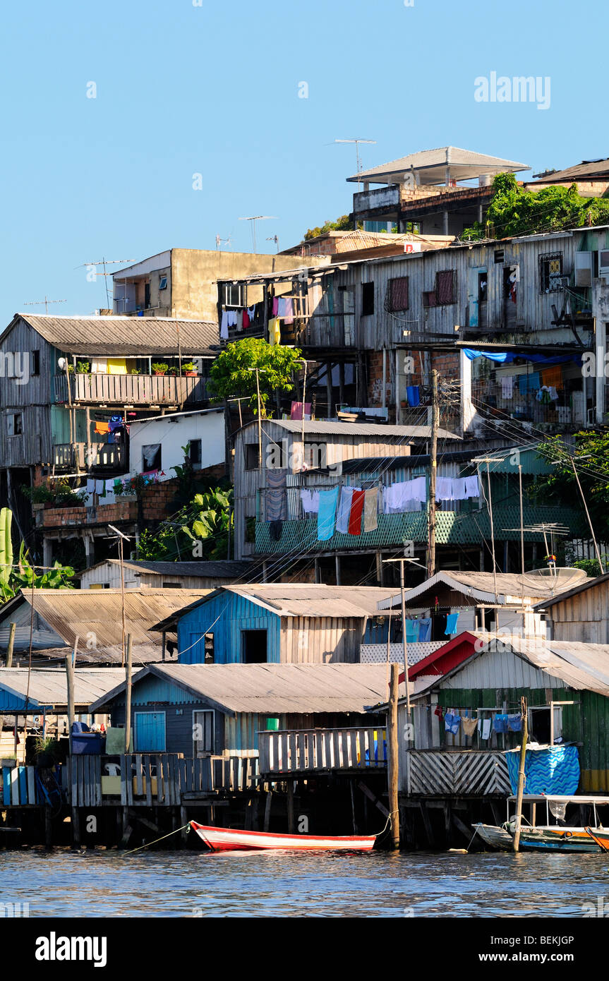 Stilt houses on a Manaus slum favela at the Negro river margins, Amazon, Brazil. Stock Photo