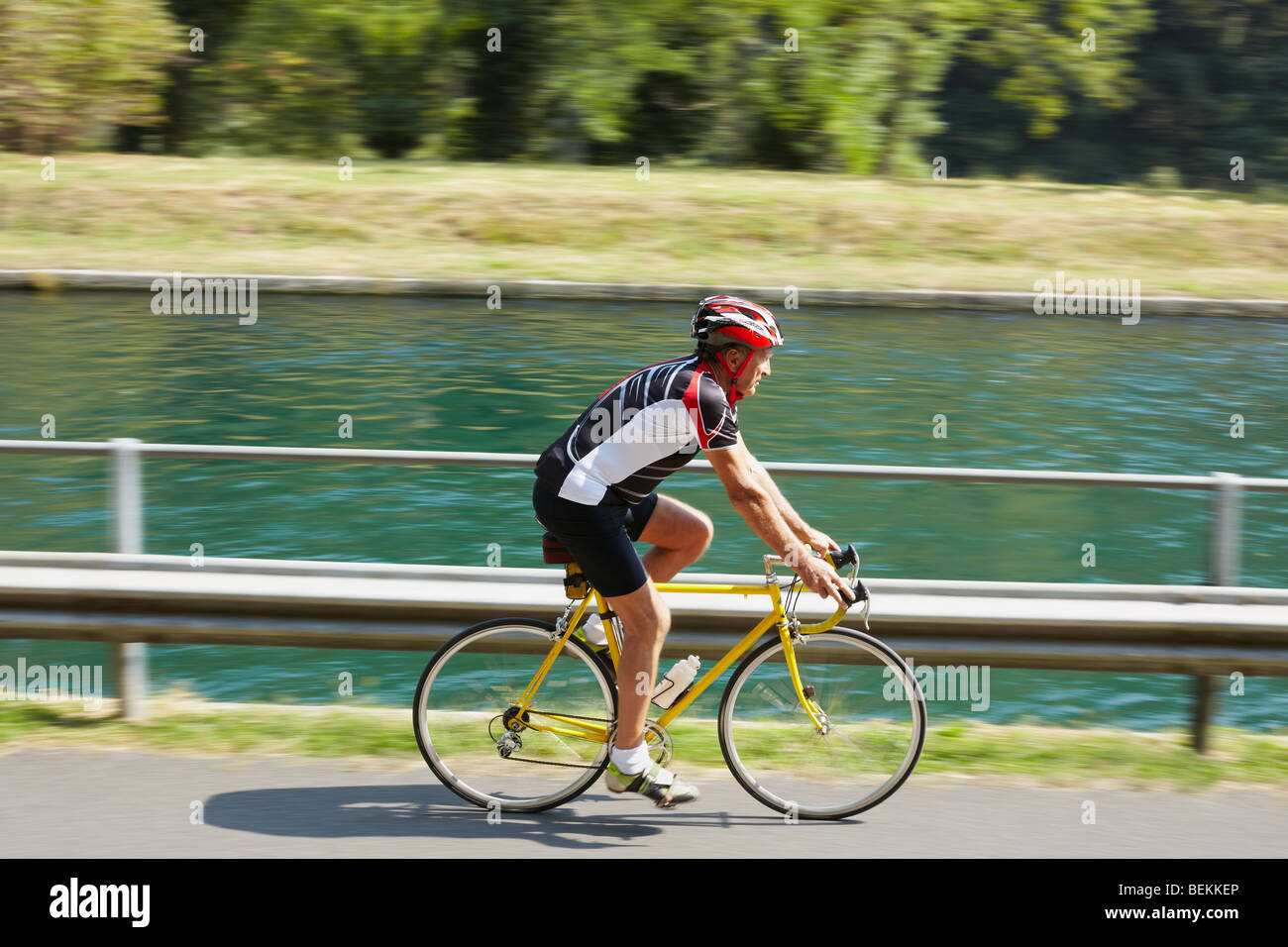 Senior bicyclist on road bike. Blurred background. Copy space Stock Photo