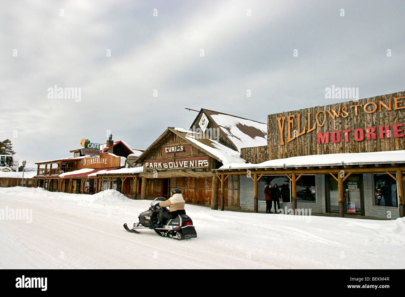 Snowmobiling down Yellowstone Avenue in West Yellowstone, Montana