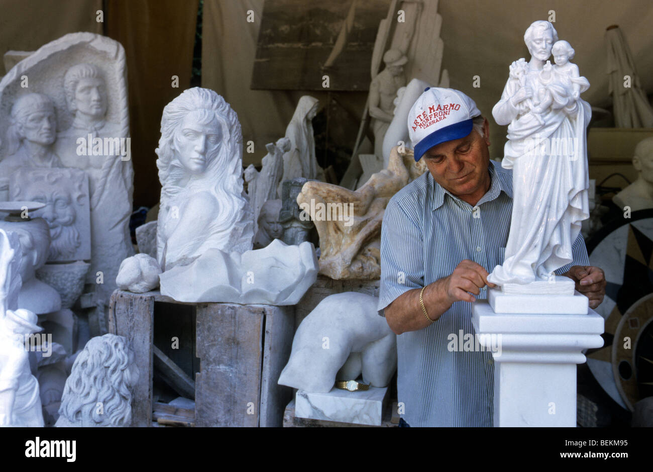 Sculpture working on marble sculptures in in Carrara, Italy