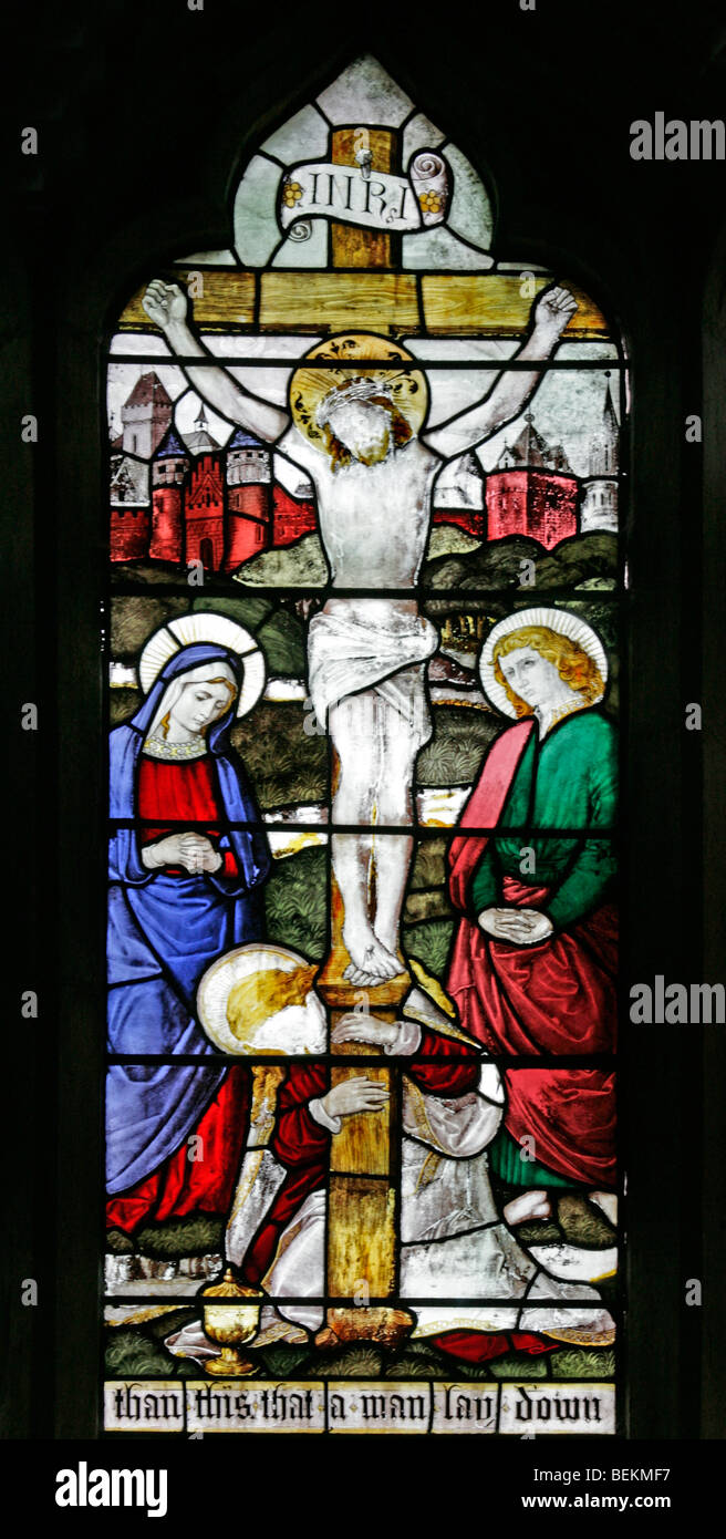 A detail from the stained glass east window at all Saints Church, Shipdham, Norfolk depicting the crucifixion of Jesus Christ Stock Photo