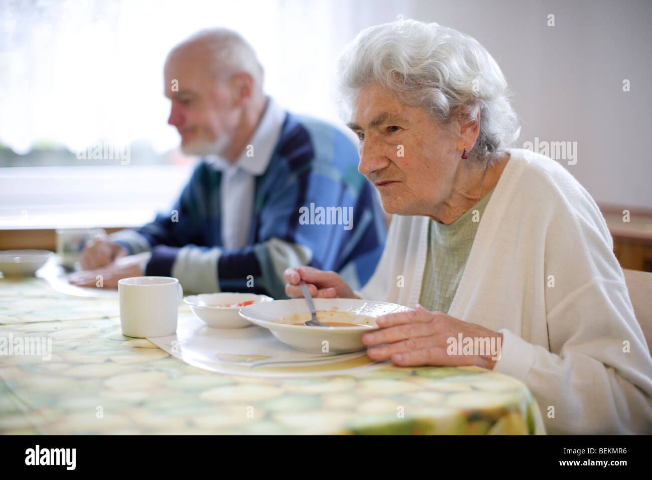 Senior Woman eating in a Hospice Stock Photo