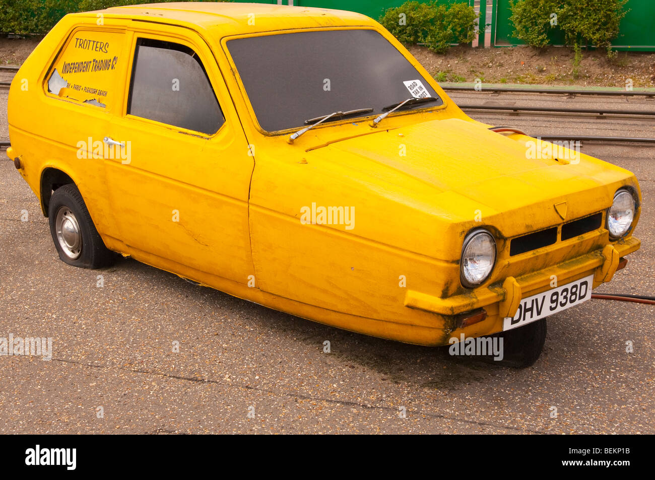A yellow Robin Reliant from only fools & horses with Trotters Independent Trading Co. on the side in the Uk Stock Photo