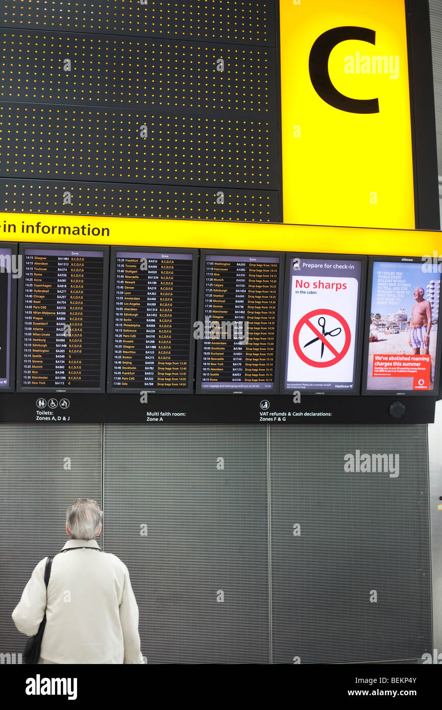 A departures board at terminal 5 of heathrow airport hires stock