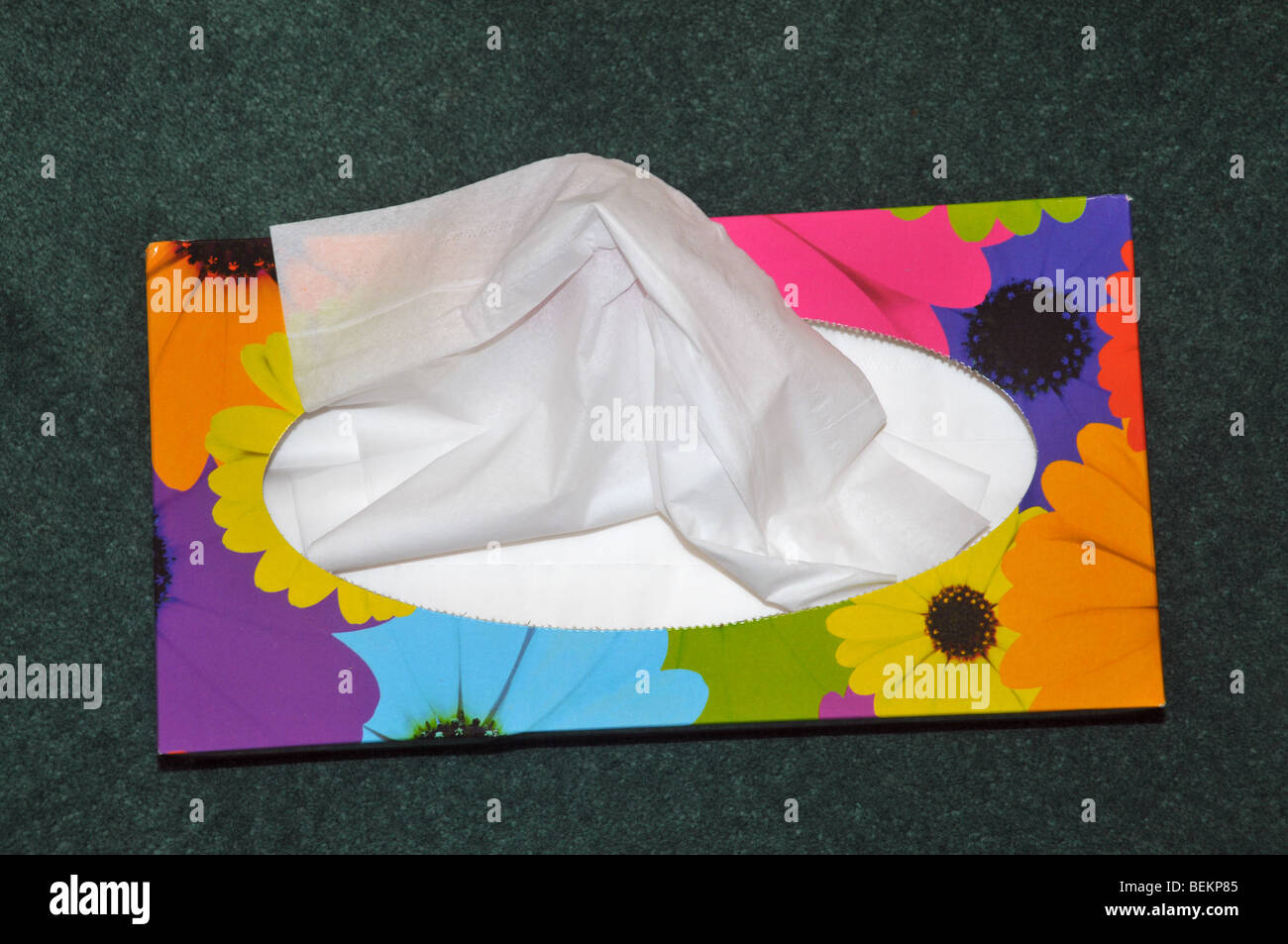 Looking down on a colourful open  box of paper tissues. Stock Photo