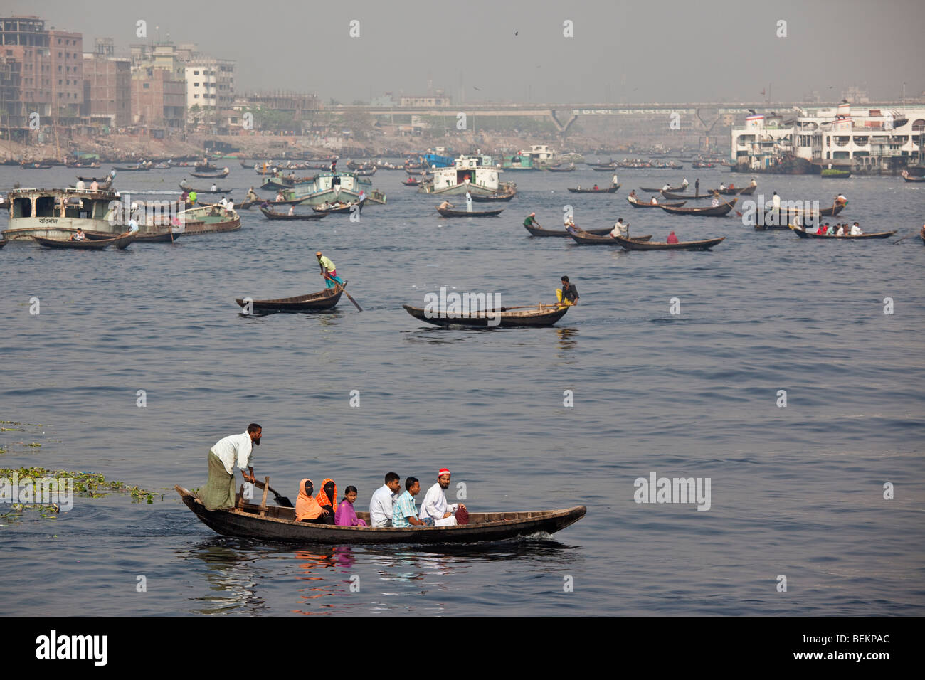 Dingi Nouka, small boats acting as water taxis on the Buriganga River in Dhaka, Bangladesh Stock Photo