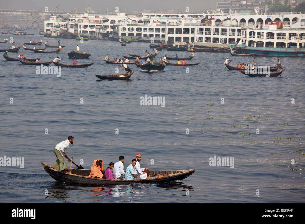 Dingi Nouka, small boats acting as water taxis on the Buriganga River in Dhaka, Bangladesh Stock Photo