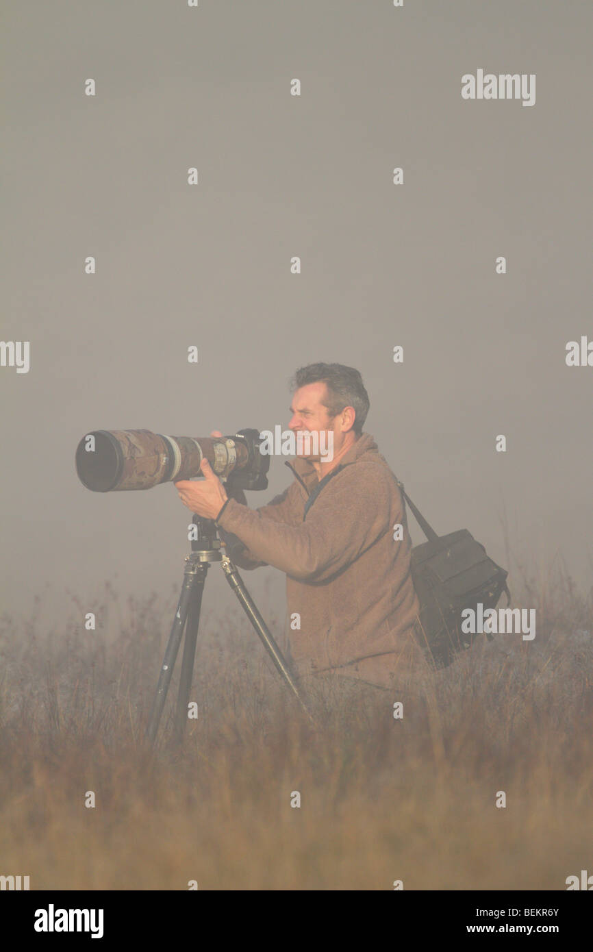 Photographer with long lens Stock Photo
